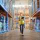 Futuristic Technology Retail Warehouse: Worker Doing Inventory W